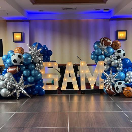 Game On: Sports, in bold silver, blue and black. Bar Mitzvah at Renaissance Charlotte, planned by Razzle Dazzle Event Planning, Charlotte NC. Photo 2 of 8.
