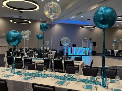 Lizzy's Bat Mitzvah: Teal, silver and white, with LIZZY in marquee lights. Bat Mitzvah at Marriott Waverly, Charlotte, planned by Razzle Dazzle Event Planning, Charlotte NC. Photo 12 of 14.